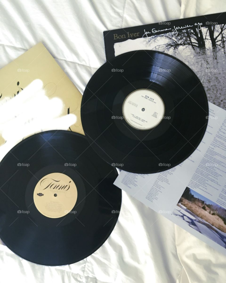 Vinyl records on a bed