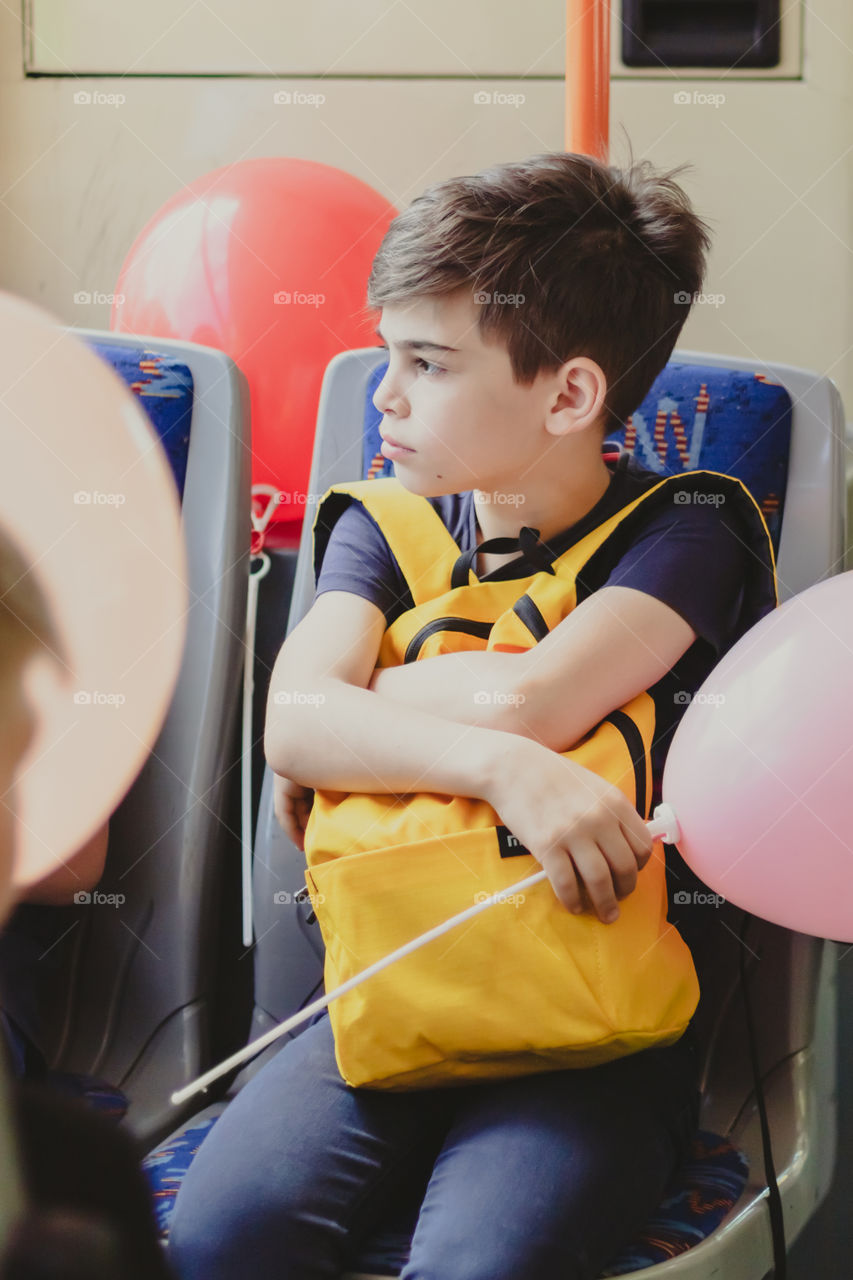 Child with schoolbag goes to school. Time to back to school.