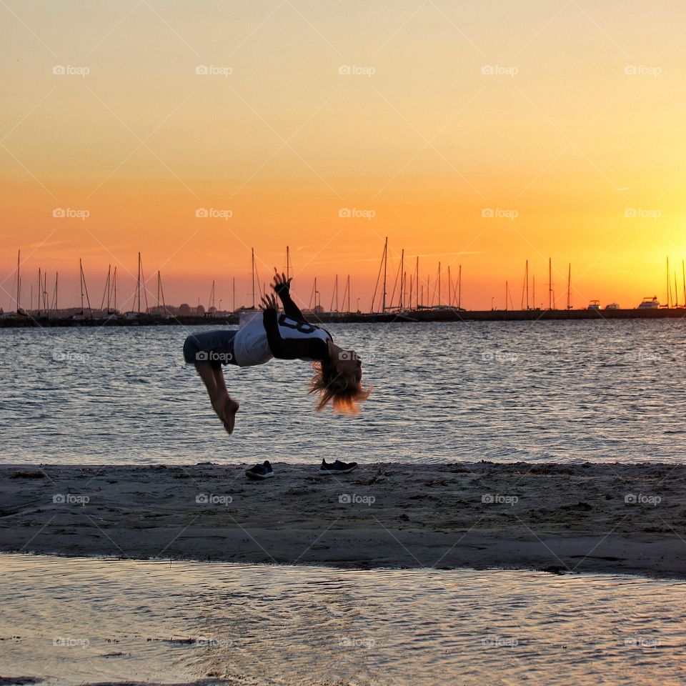 Back flip in sunset