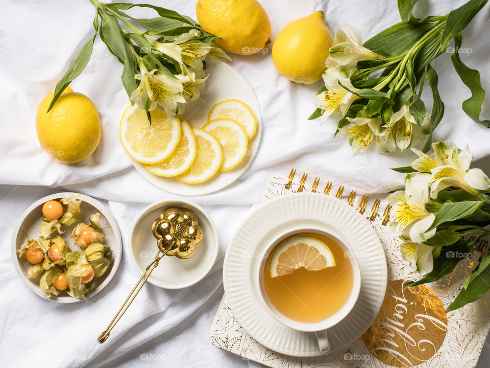 Lemon tea with lemon slices on a plate