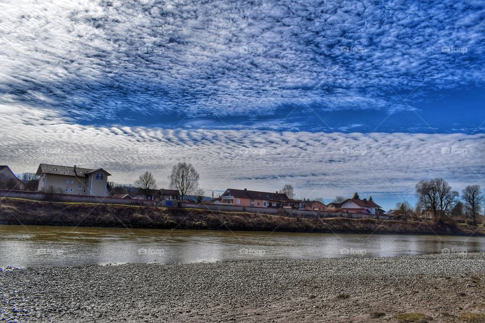 Houses against cloudy sky