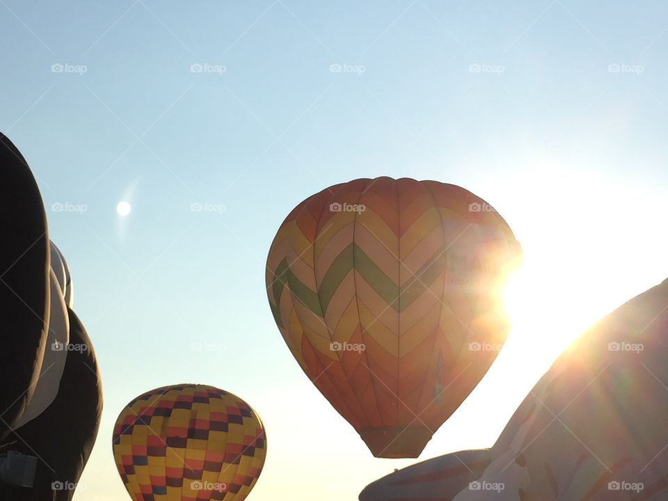 Balloons floating during summer sunset 