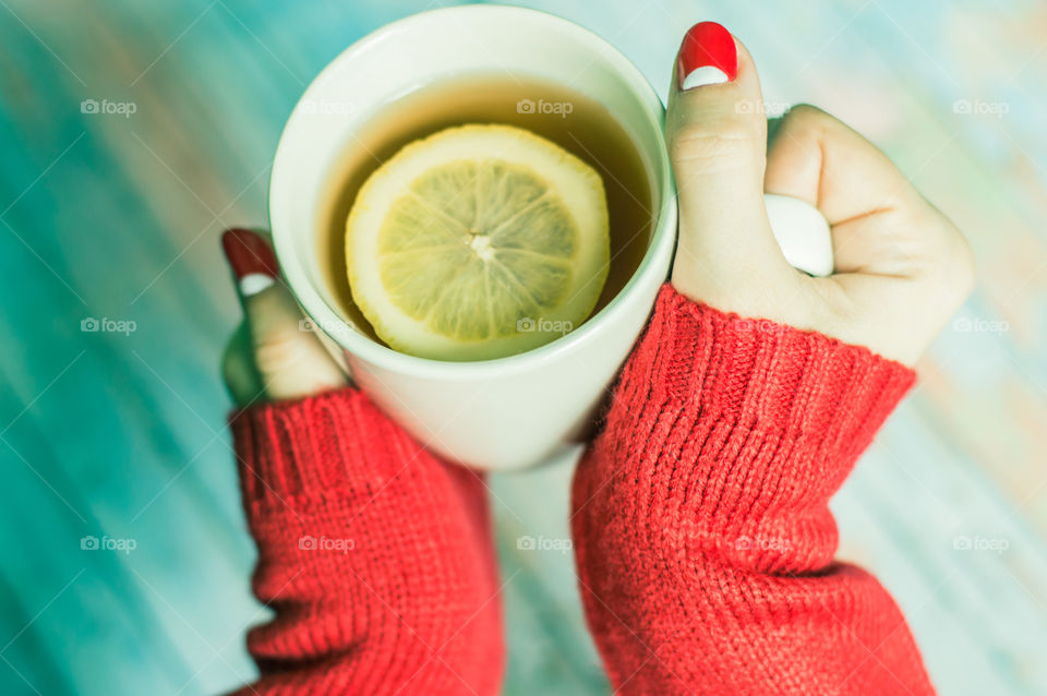 woman hand with cup of tea