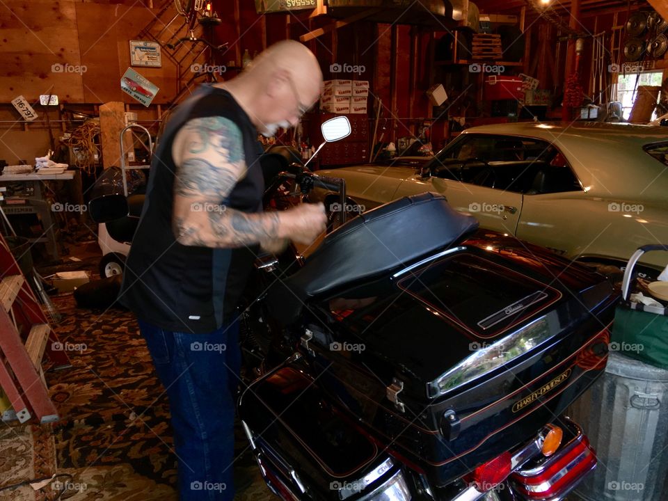 Working on motorcycle, in the garage. 🏍