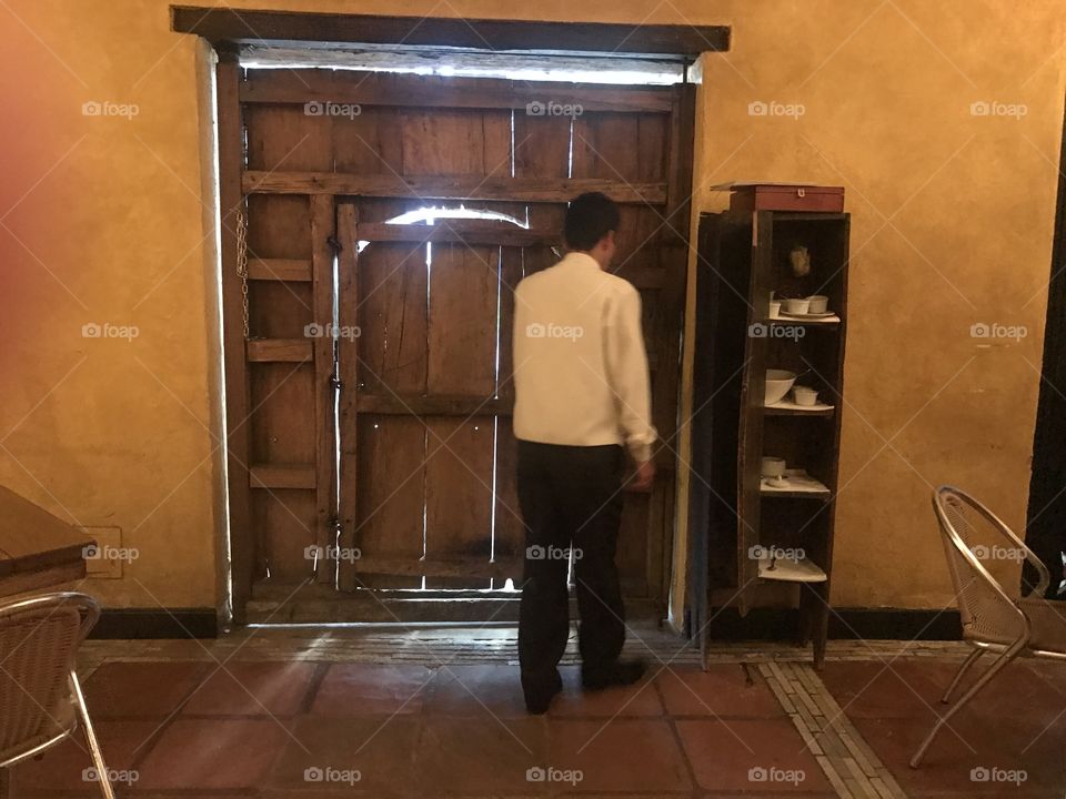 Big man, small door