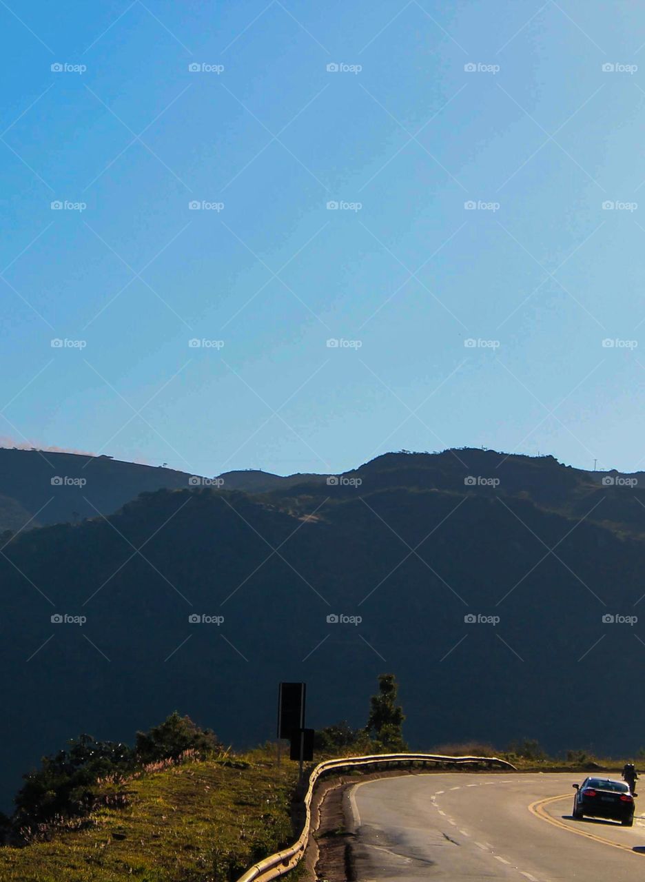 scenic view of mountains against clear blue sky