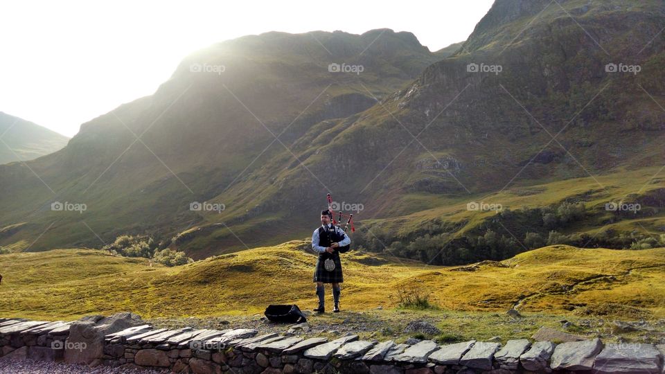 Just a piper piping in the Highlands. As they do.