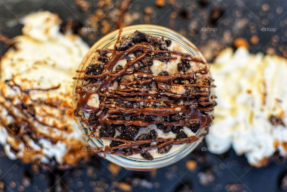 High angle of yogurt with cream and chocolate