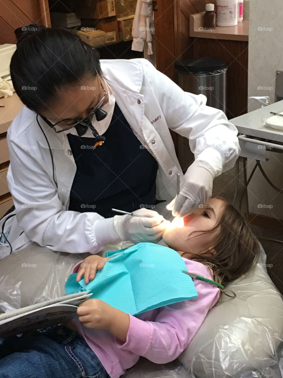My little girls dental exam with a pass of healthy teeth! 
