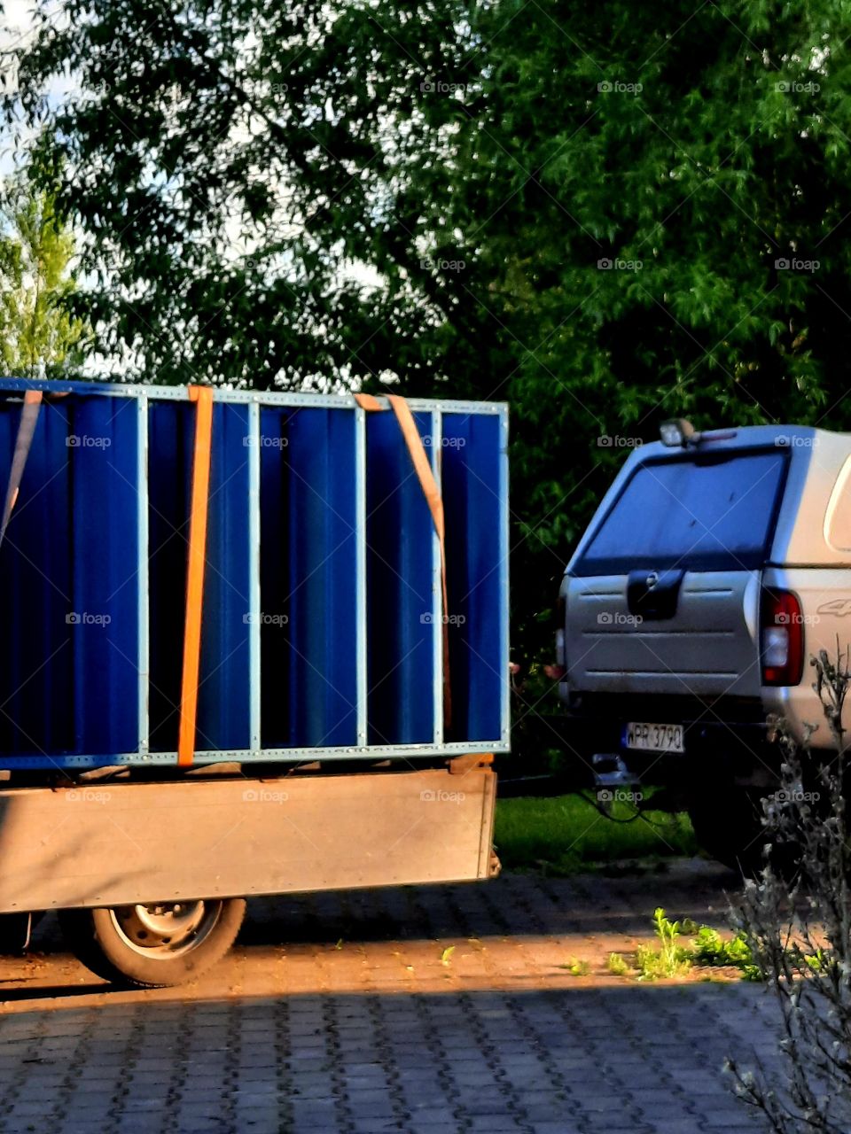 blue metal shelfs and orange belt on a trailer