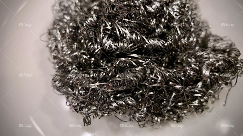 Scrubbing pad? Magnetic tape? Pencil shavings? Whatever it is, it looks cool up close. Macro lens, black and white photography. 