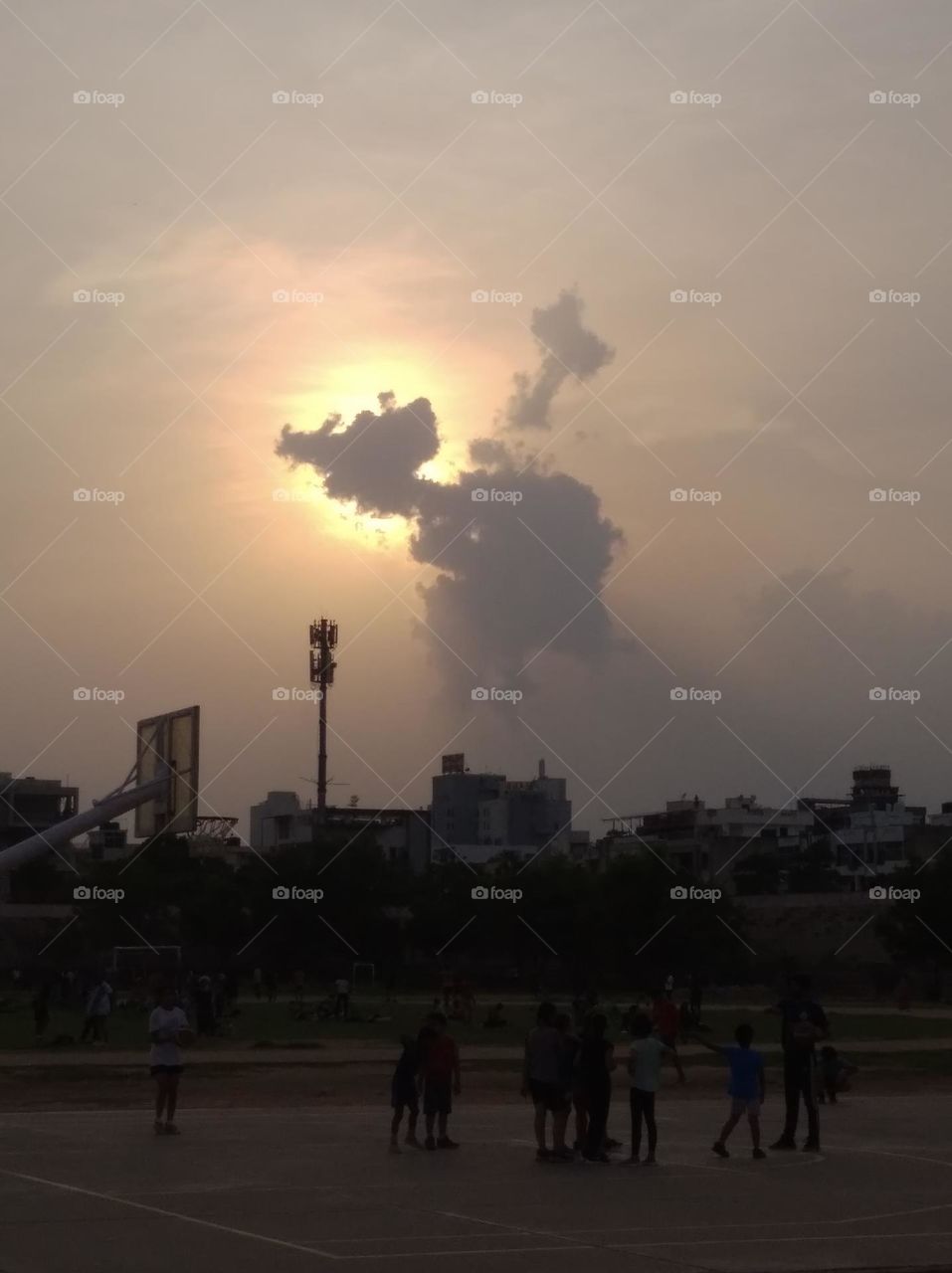 an evening secene sun cloud in front of sun, cloud looks like a horse,sky, sunlight looks very beautiful