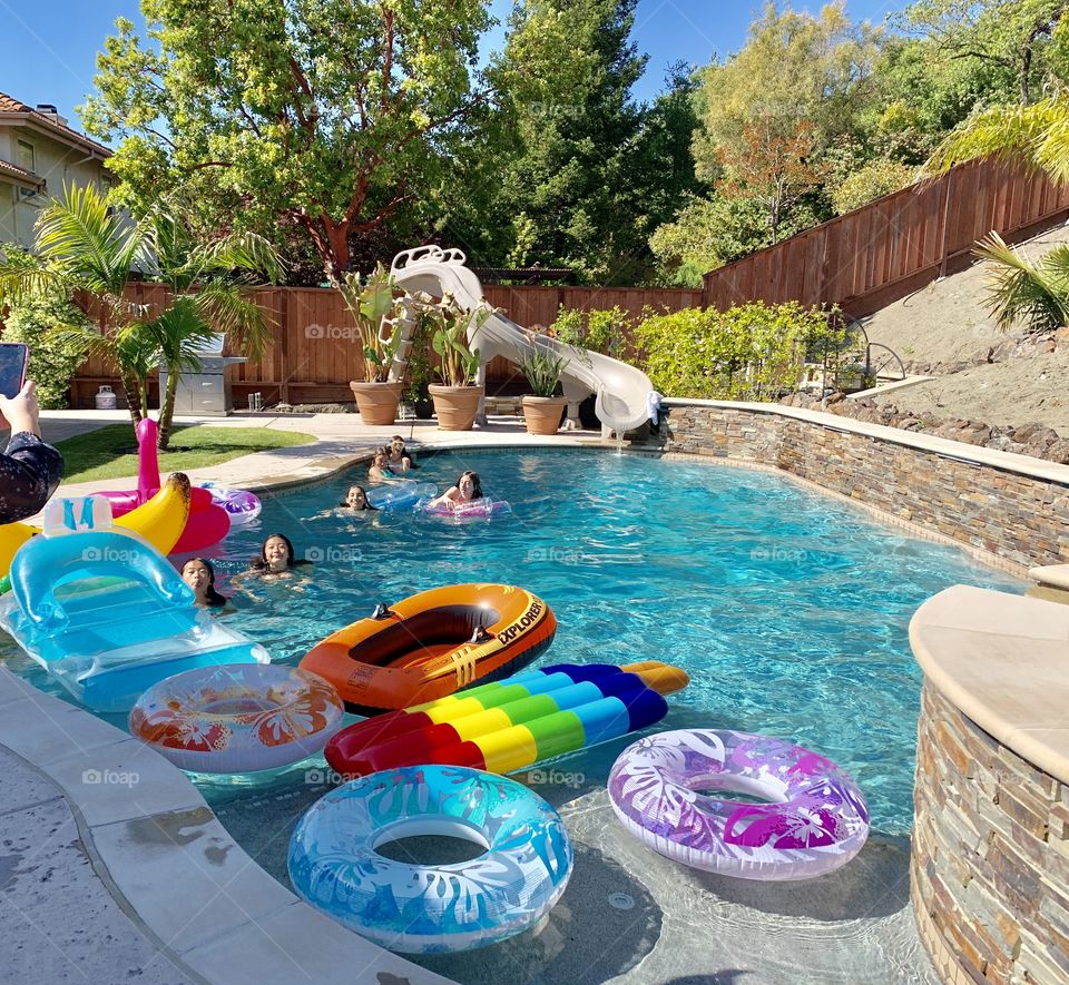 Promotion/graduation pool in full affect with  a ton of floaties. 