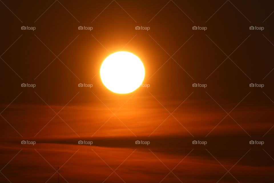 Romantic sky in orange shades during sunrise 