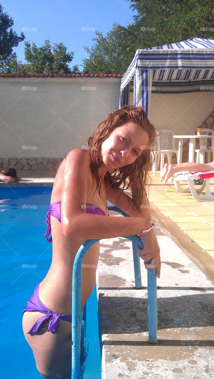 Woman standing in swimming pool