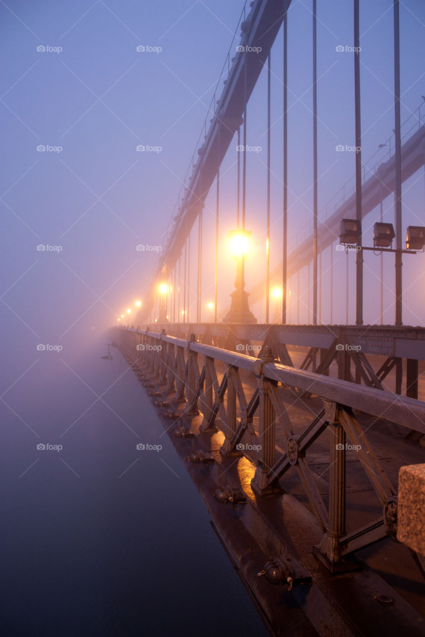 A bridge disappearing in the fog