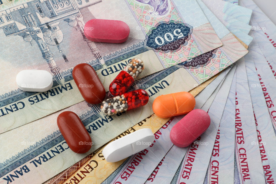 Medicines on uae dirham money currency notes