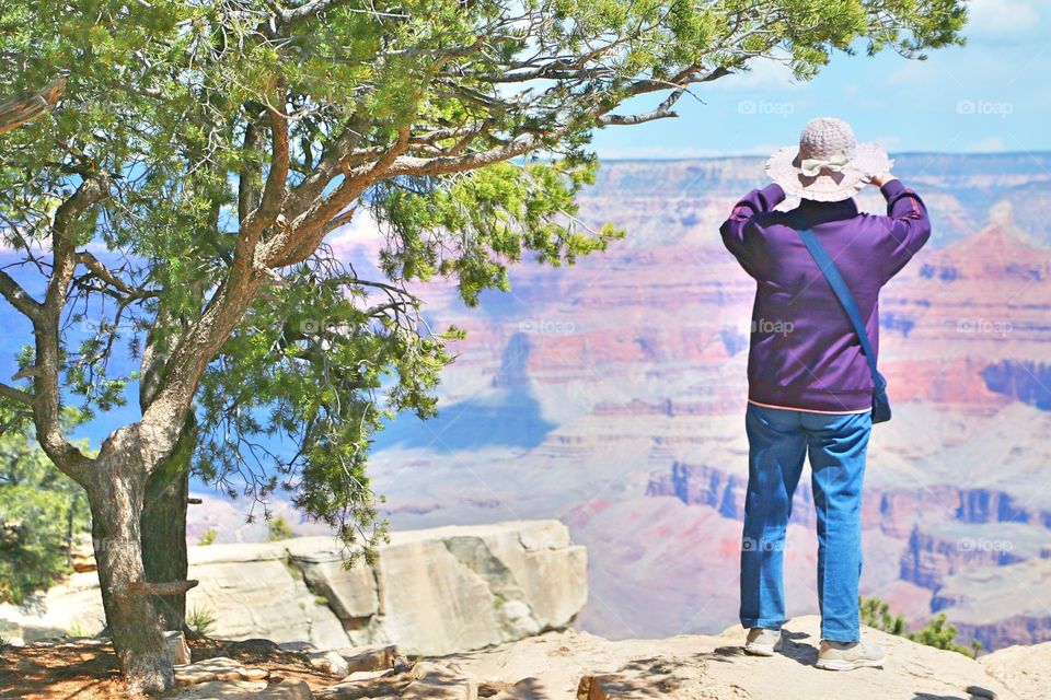 Woman taking picture at the Grand Canyon 