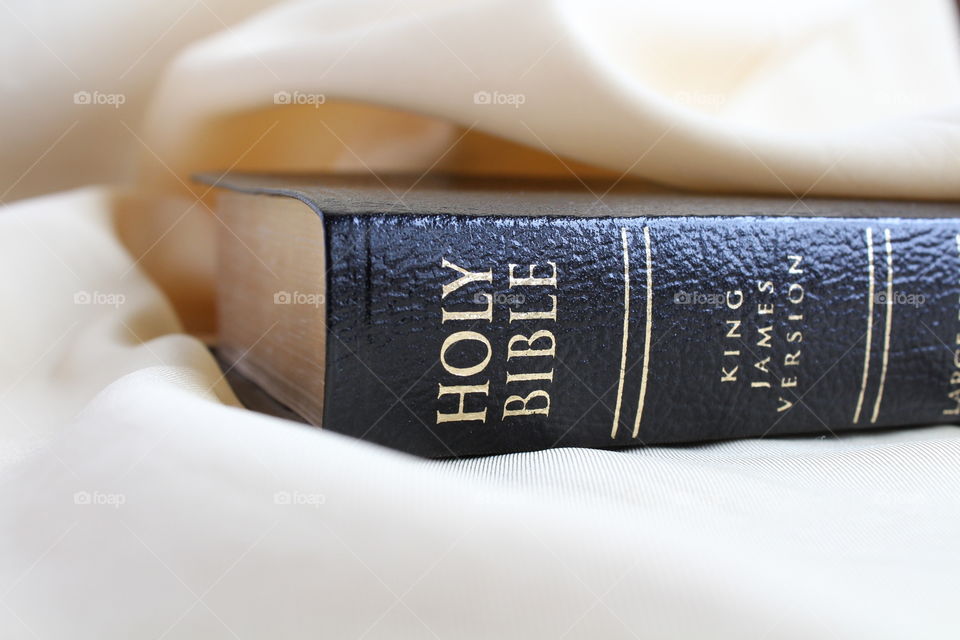 holy Bible on gold background