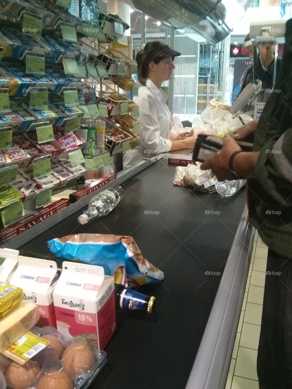 The cashier at the store. Showcase, commodity, price, buyers. Trade center. Seller.