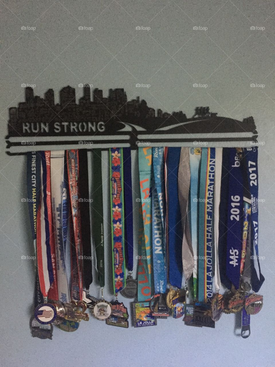 Race medals on rack