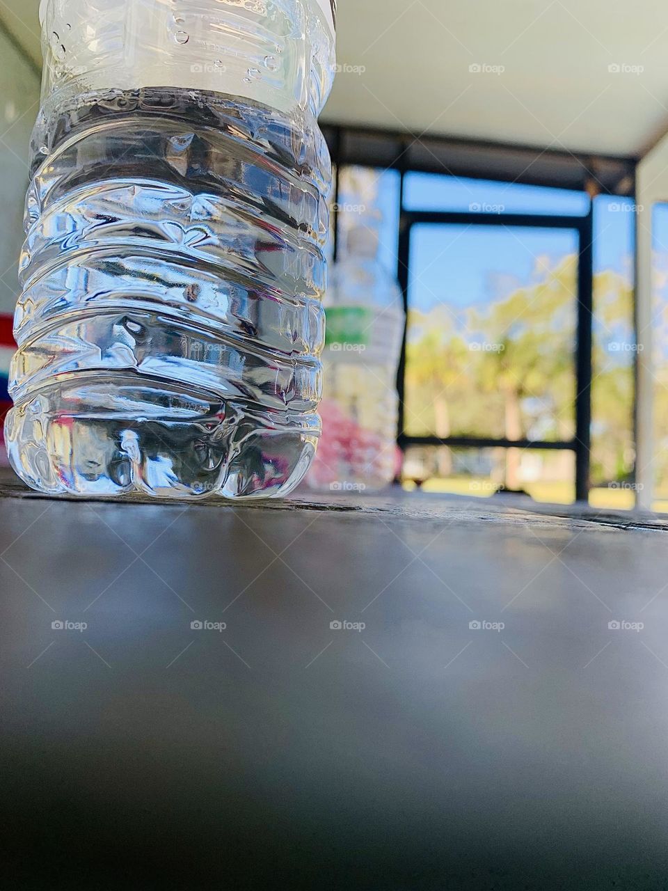 Bottles Of Water On The Table Outside In The Porch While It Is Warm.