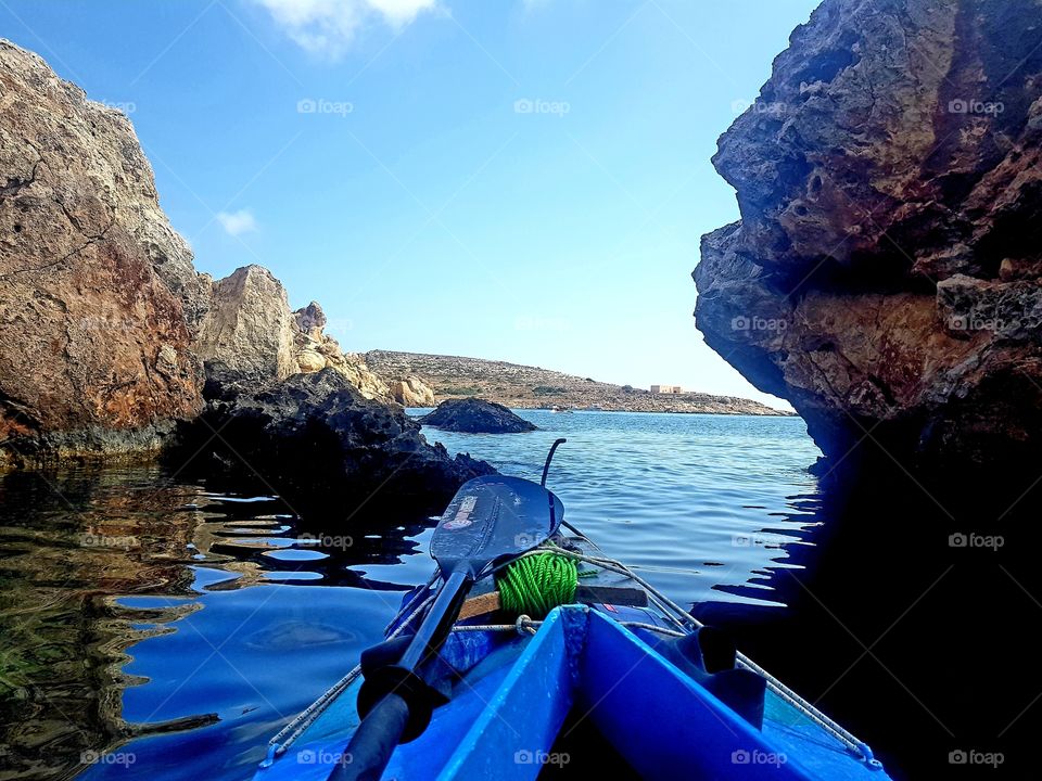 kayaking in the bright blue Mediterranean