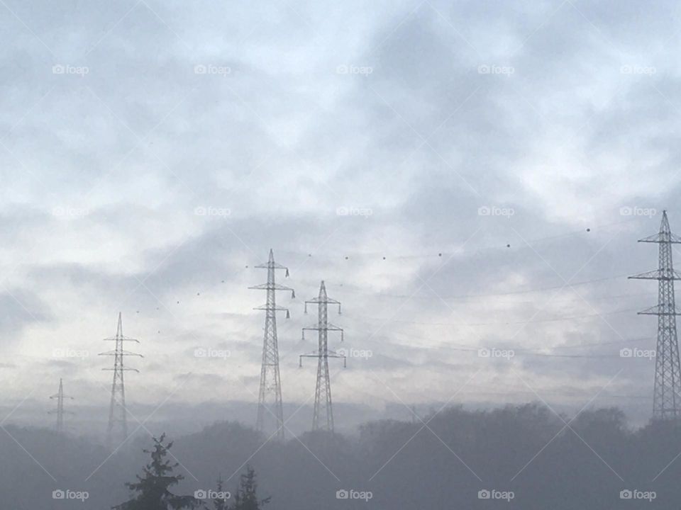 Electric pylons in the mist 