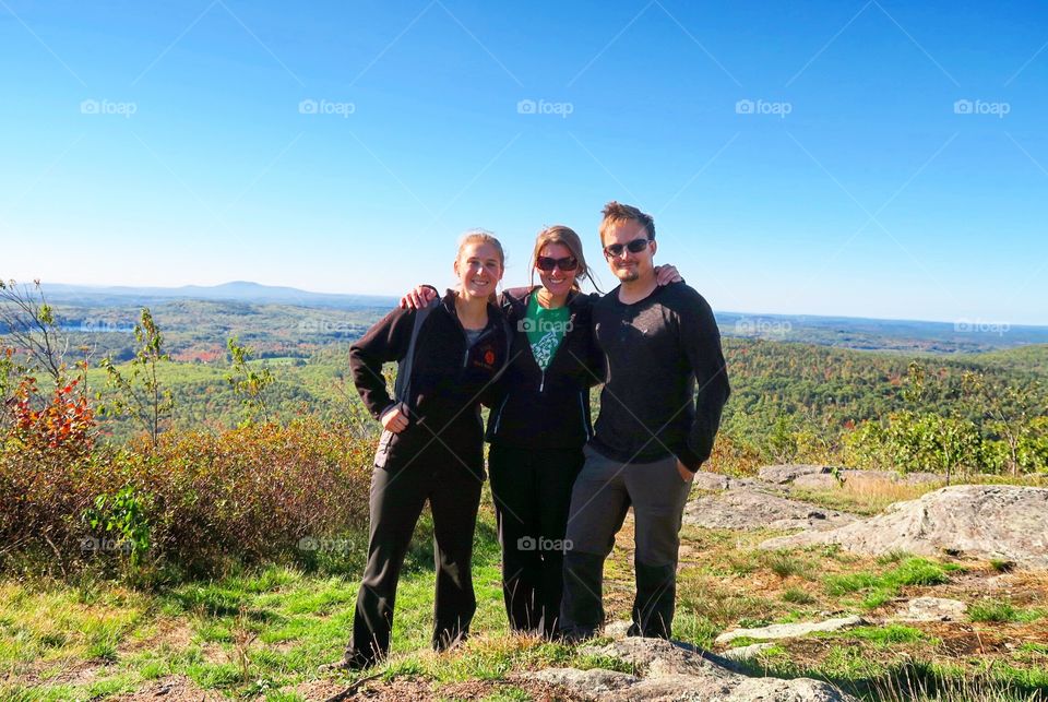 People hiking and  smiling 