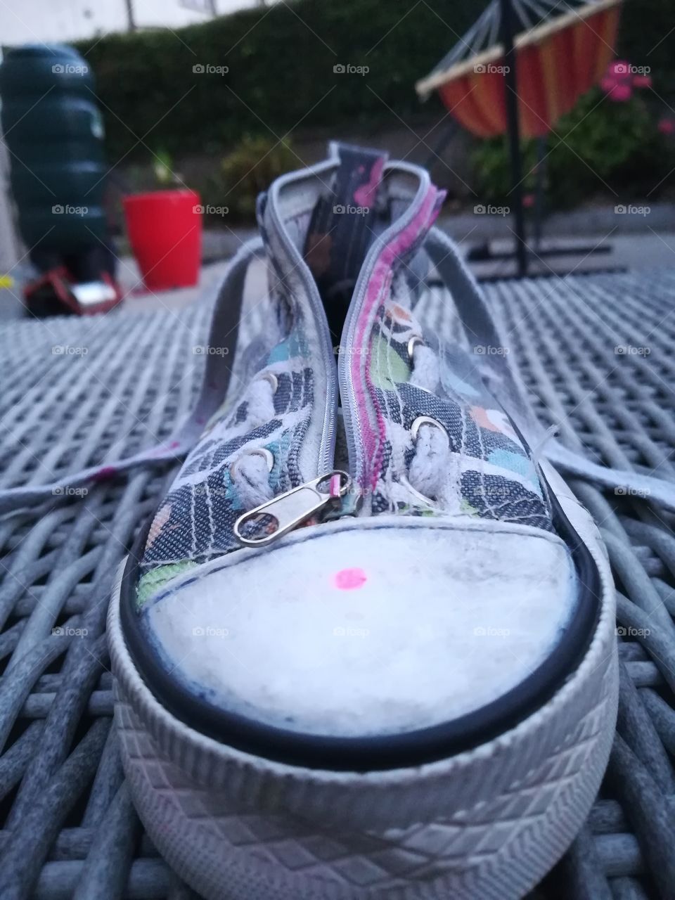 A close up of a pencil case shoe.