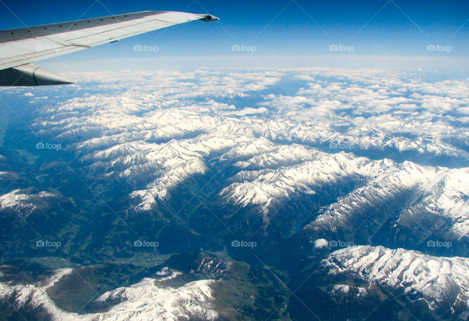view in flight over Alpine mountains