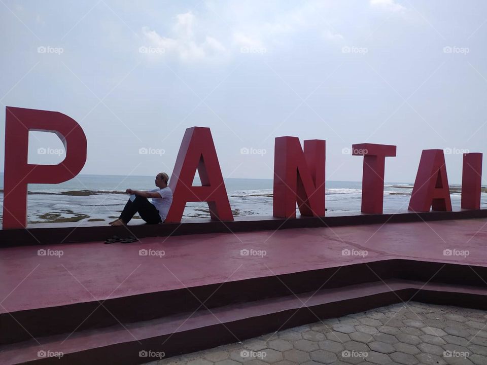 at the beach's border