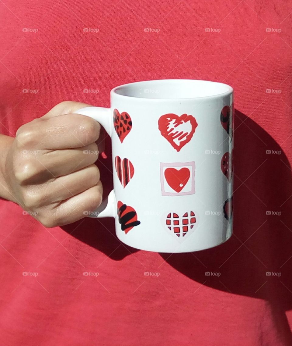 holding a cup of hearts