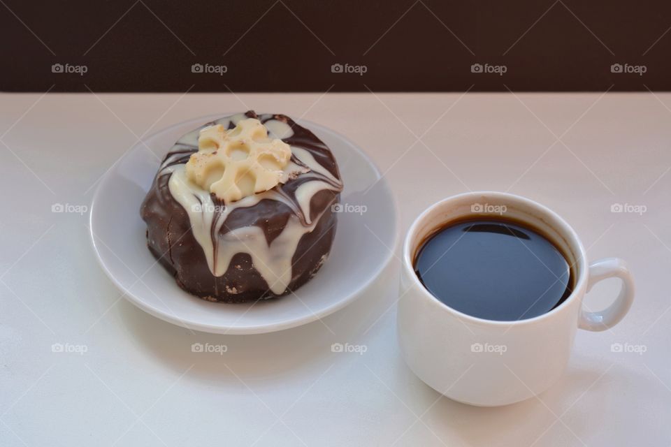 cup of coffee and cake on a white background