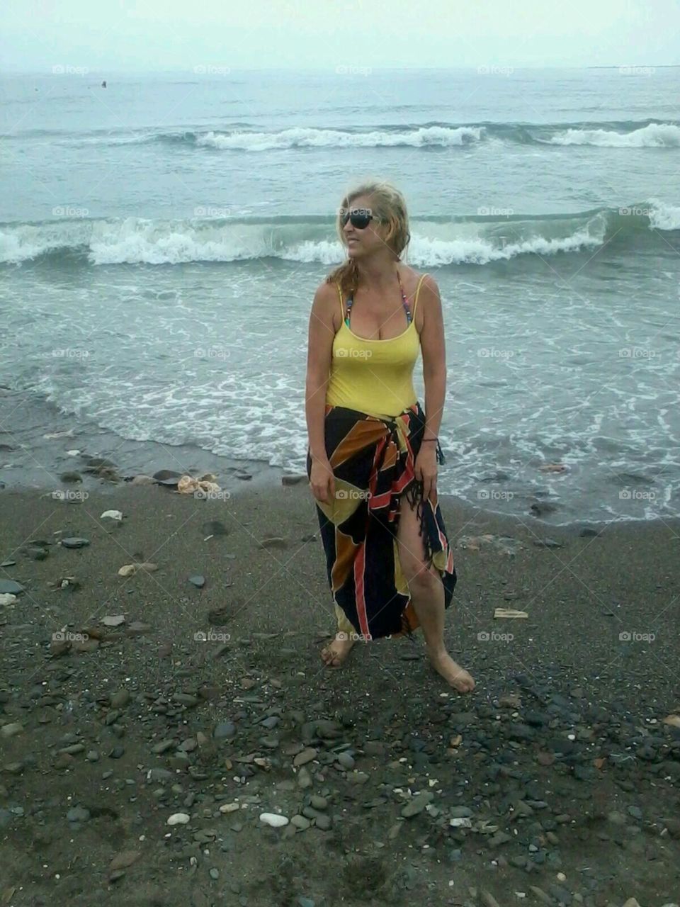 Mid adult woman standing on beach