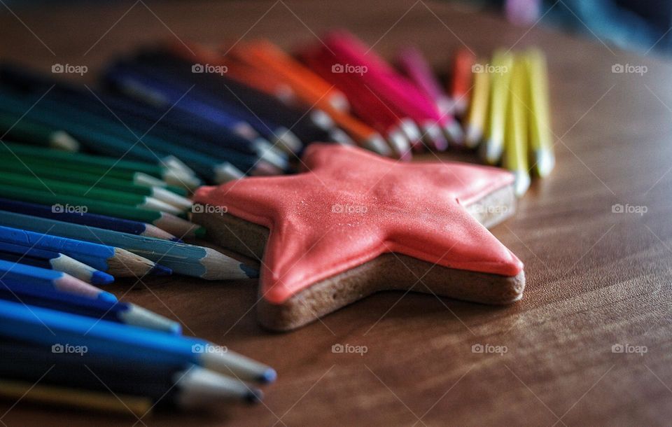 cookies with sugar icing and colored pencils for drawing high contrast