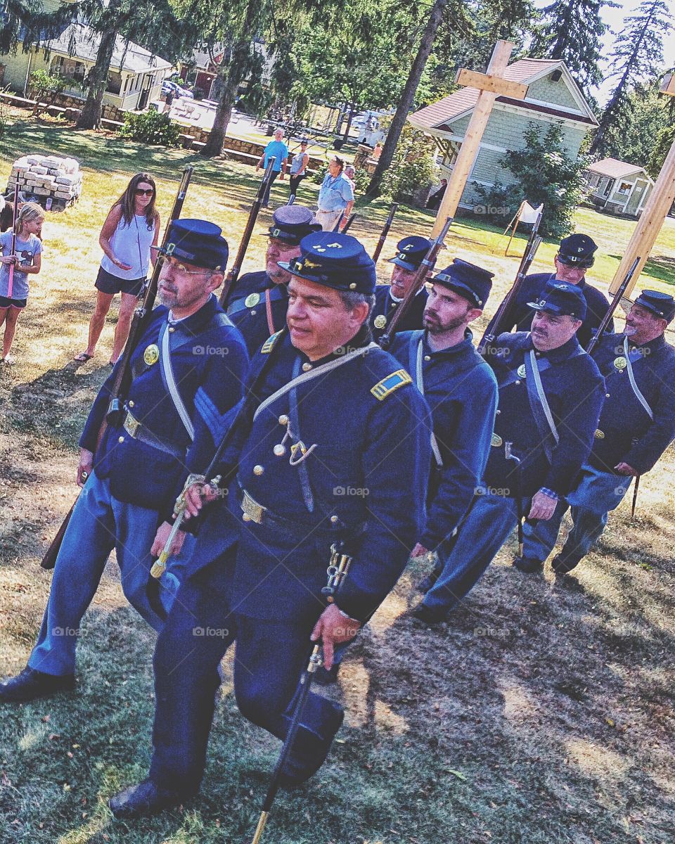 Man in military uniform walking together