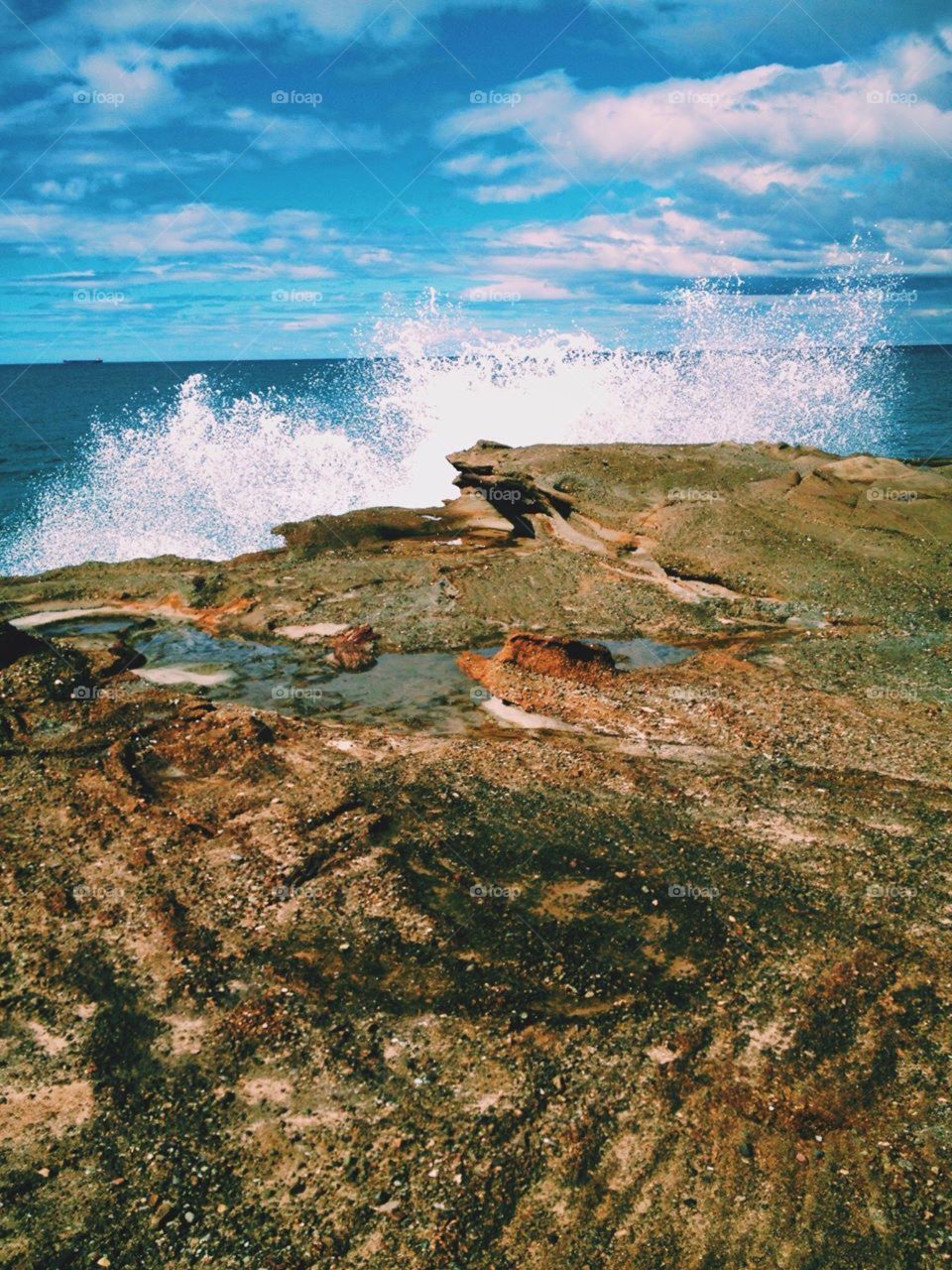 Wave crashing on rocks