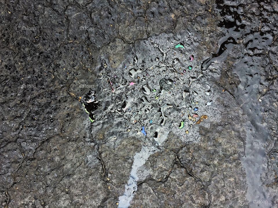 Water and oil on asphalt cement