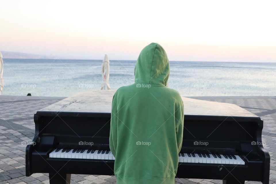 Playing piano on the beach
