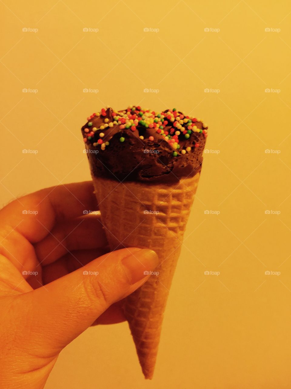 ice cream. hand holding ice cream