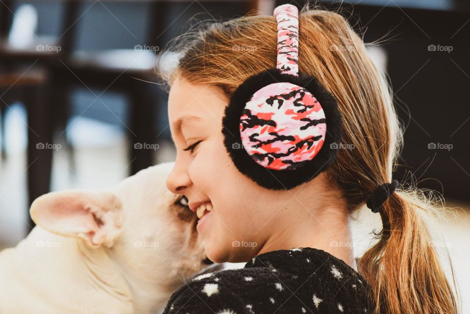 A kiss on cheek by her favorite buddy