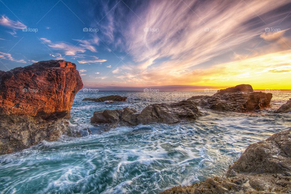 Coastal Sunset. The sun sets over a rugged Coastal landscape in Cornwall, England.