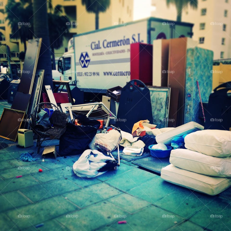Rubbish and furniture dumped at recycling point, Marbella street, Spain