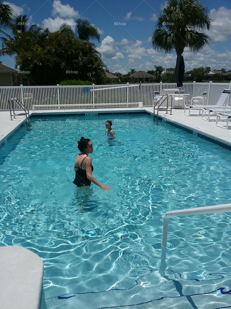 The girls going for a swim on vacay in Florida.