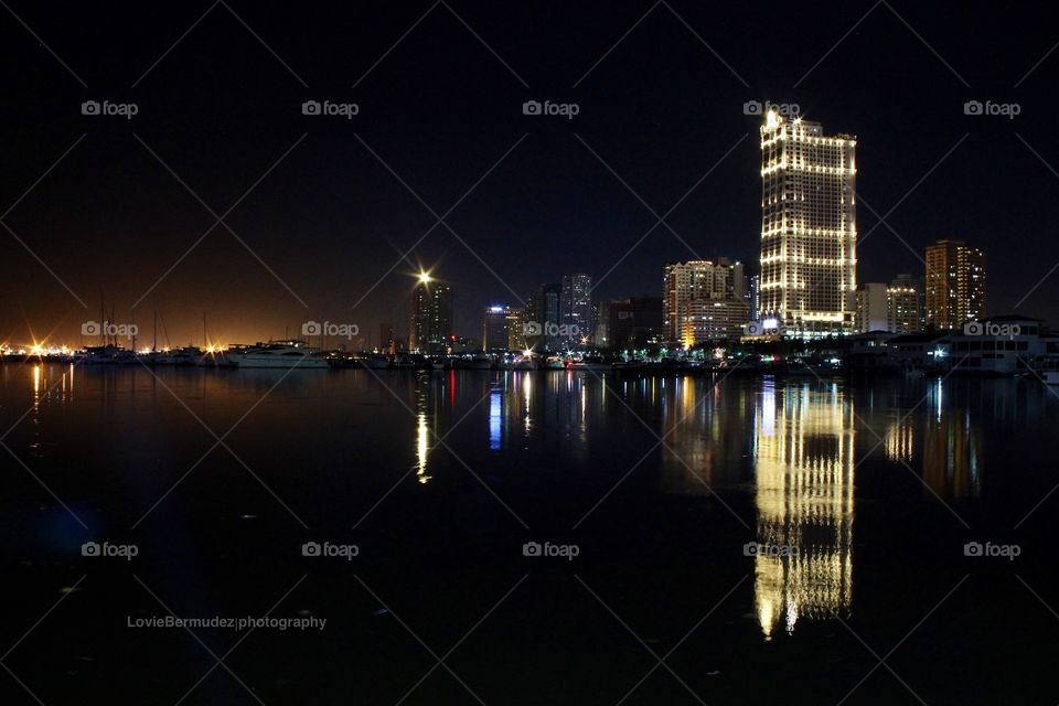Building reflection in Harbor Bay Manila Philippines