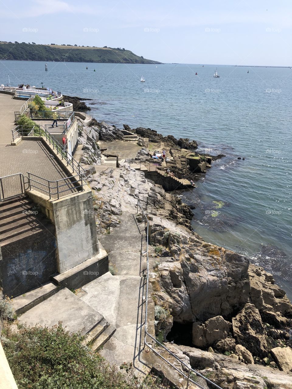 High tide is here at Plymouth Hoe,Devon, where summer is in full swing in July 2019.