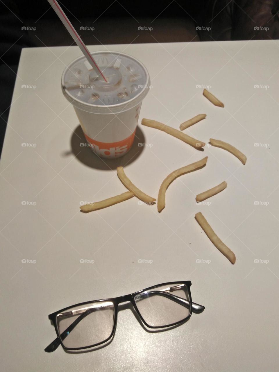 Cup of cocacola and glasses on table.