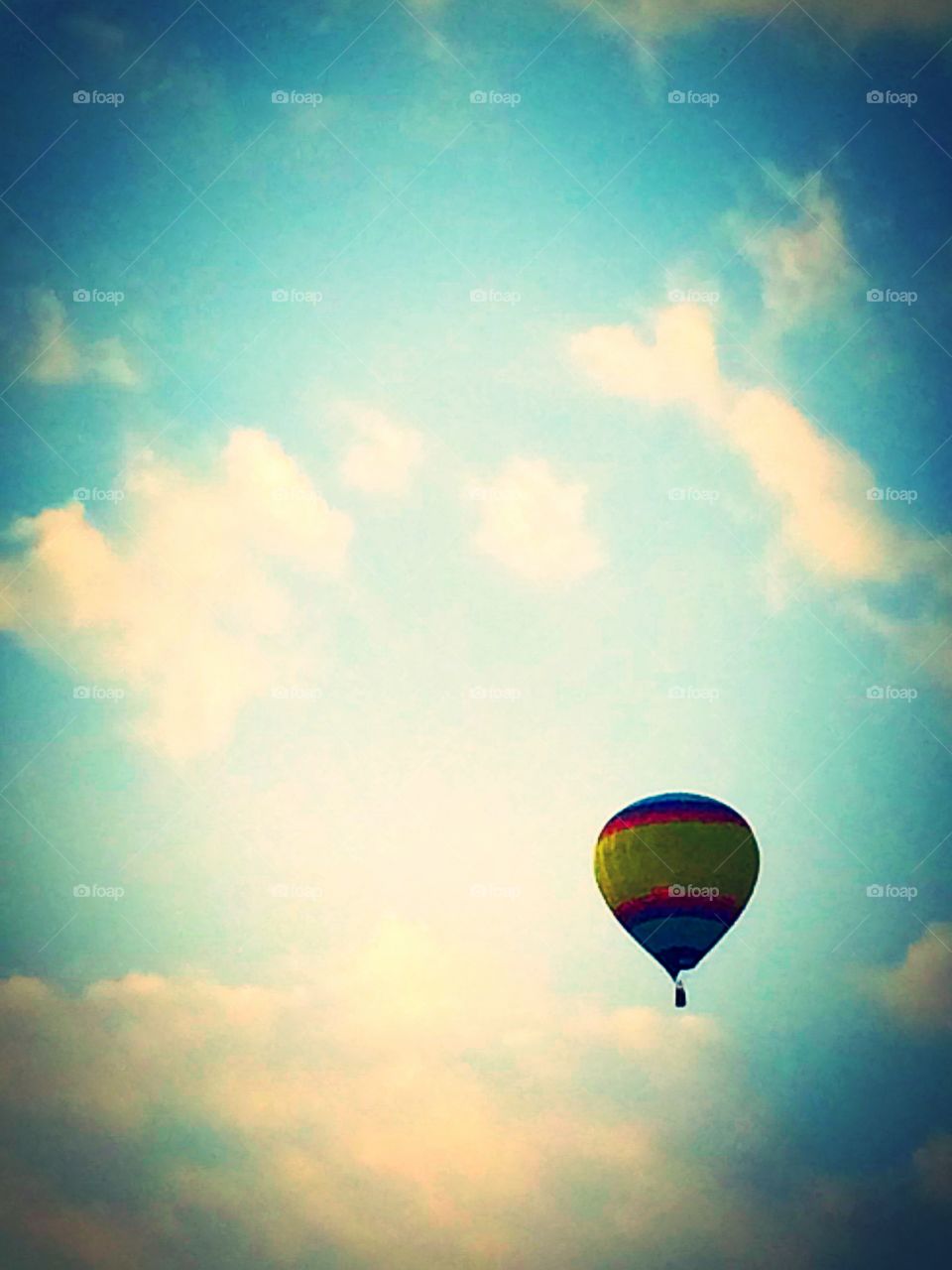 Flying High. Hot Air balloon amongst the clouds