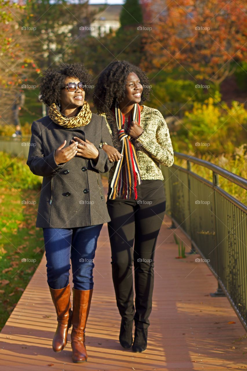 Ladies on a Walk. Ladies enjoy a walk in the park on a fall day. 